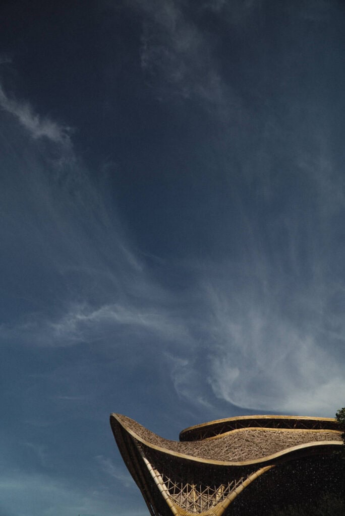 Woven rooftop architecture against the sky at Impression Isla Mujeres