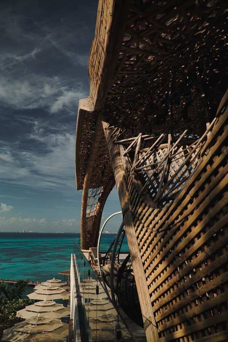 Ocean view framed by woven architecture at Impression Isla Mujeres
