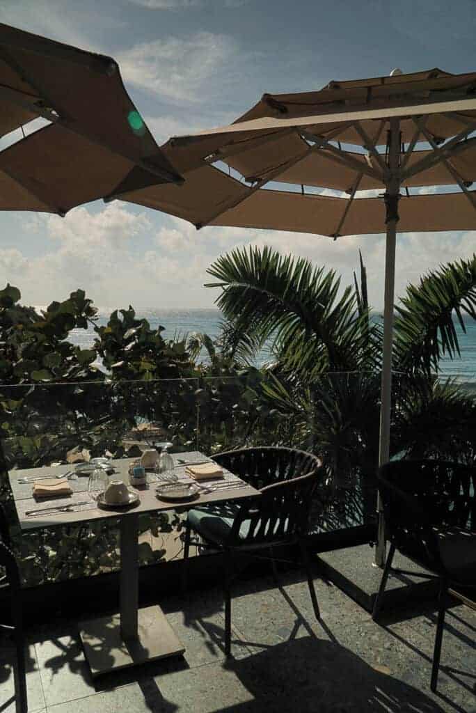 Terrace tables under umbrellas at La Vista